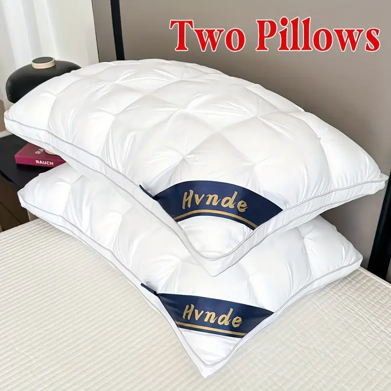2 white pillows stacked on top of each other