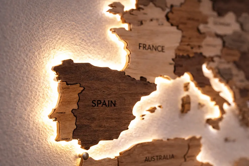 3d-led-wooden-world-map-led-glow-detail - Modern Wall Art Guides Close-up of a 3D LED wooden world map showing layered wood depth and soft backlighting