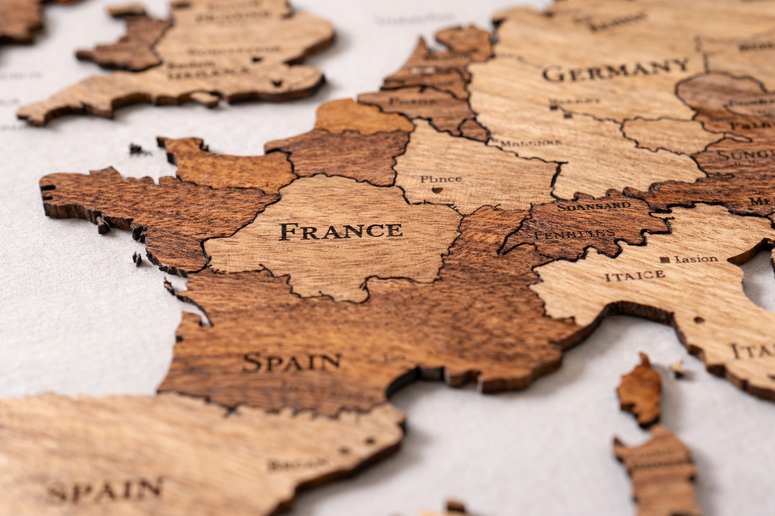 wooden-wall-map-layered-construction-detail - Modern Wall Art Guides Layered wooden wall map showing engraved country borders and wood grain